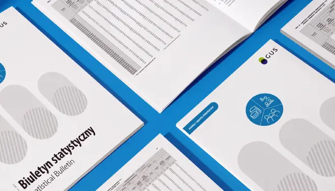 Sheets of the Statistical Bulletin laid out on a blue worktop